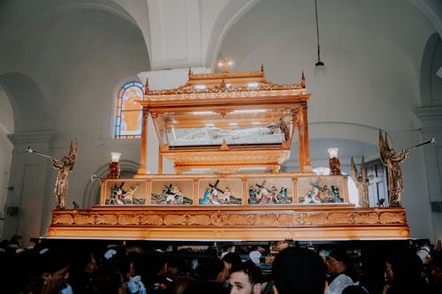 A wooden casket is in a church