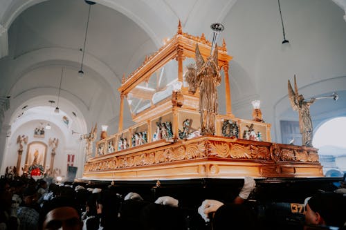 A large wooden cross is in a church