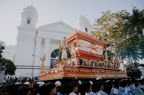 A large wooden float with a large cross on top