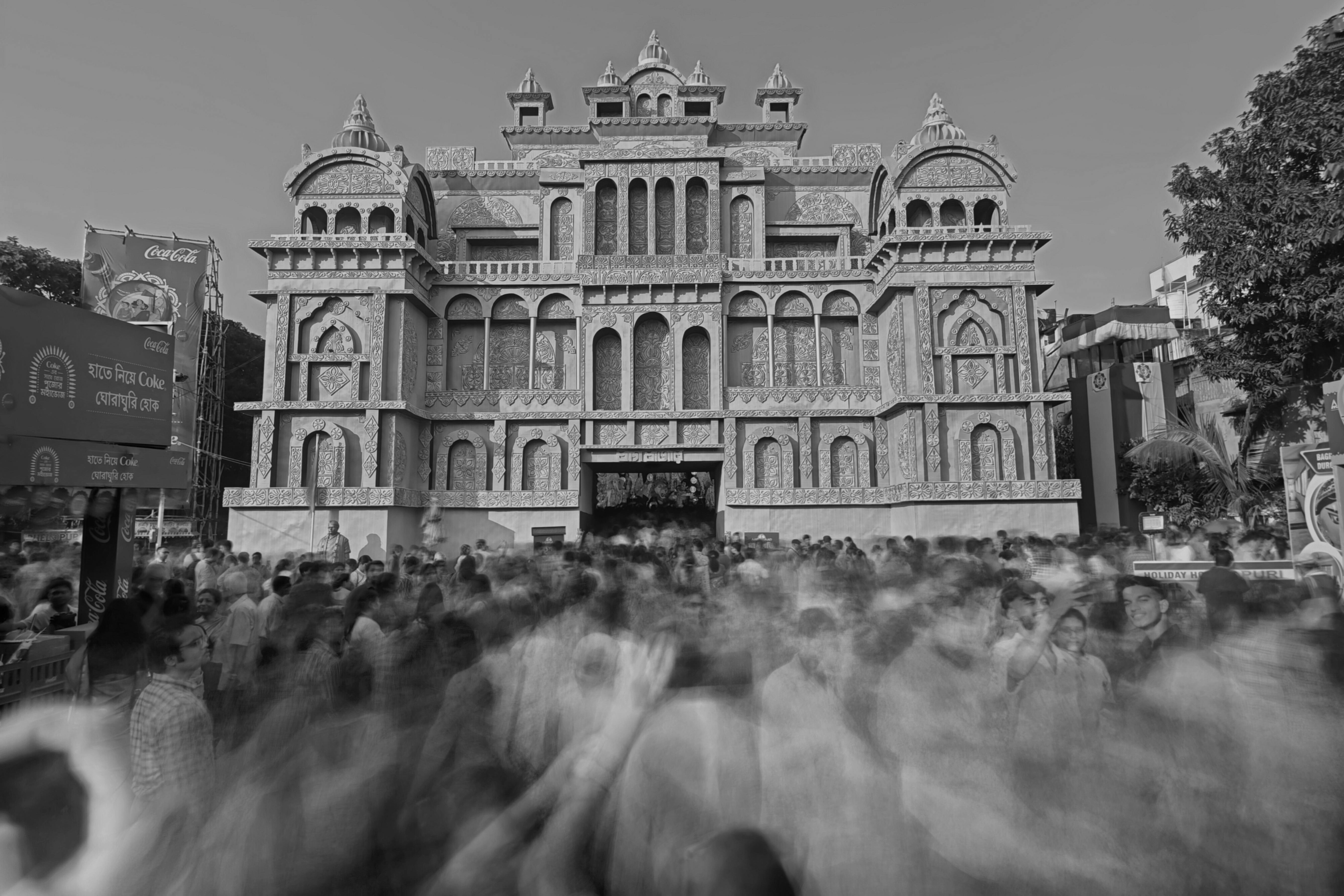 Free Black and white image capturing bustling festival crowd in front of Kolkata landmark. Stock Photo
