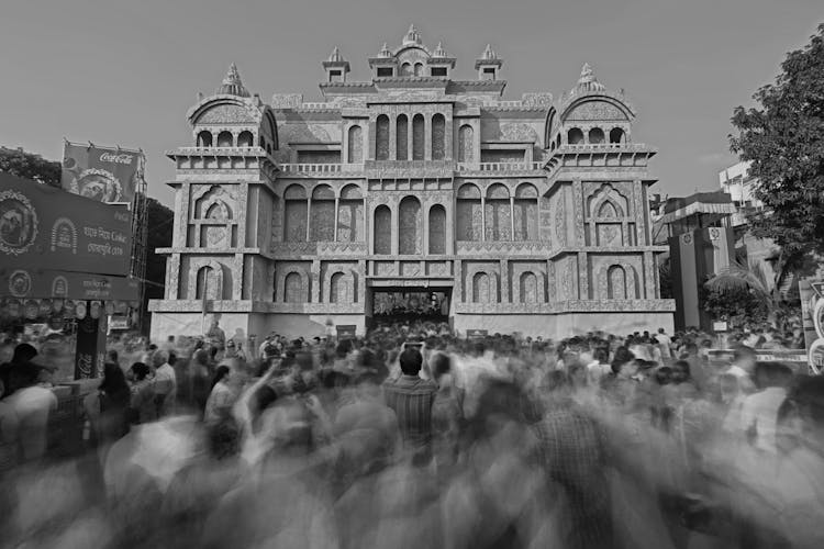 Blurred Crowd Moving Around Palace Building