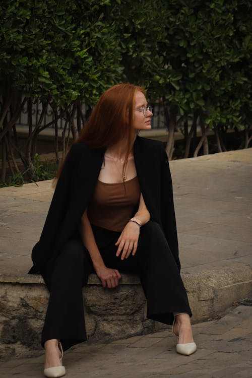 Redhead Woman Sitting in Coat