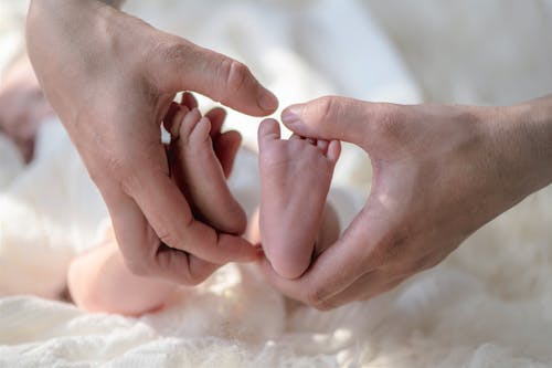 Baby feet in mother's hands 