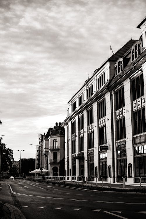 Black and white photo of a street with buildings