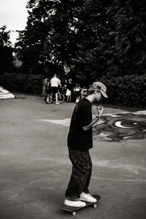 A man on a skateboard in a park