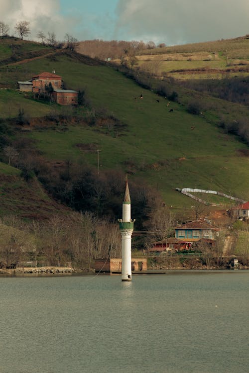 Free A Lighthouse on a Lake Stock Photo