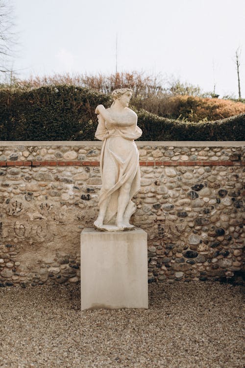 A statue of a woman holding a basket