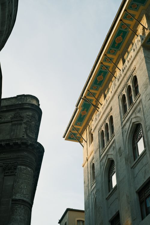 Free Low-angle shot of historic buildings with detailed architecture and clear sky. Stock Photo