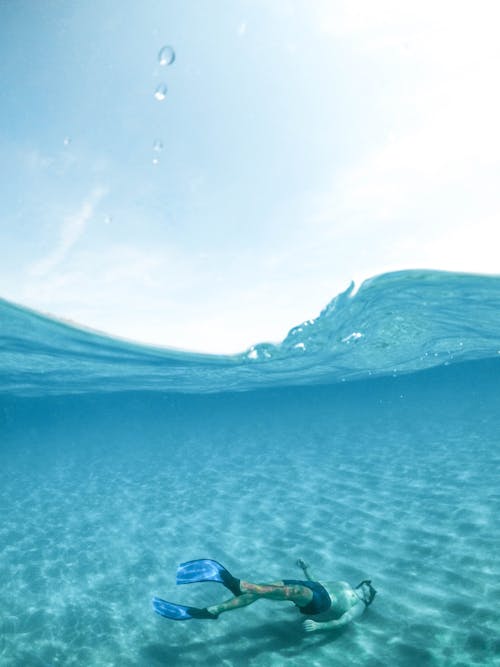 Free Man Diving on Body of Water Stock Photo