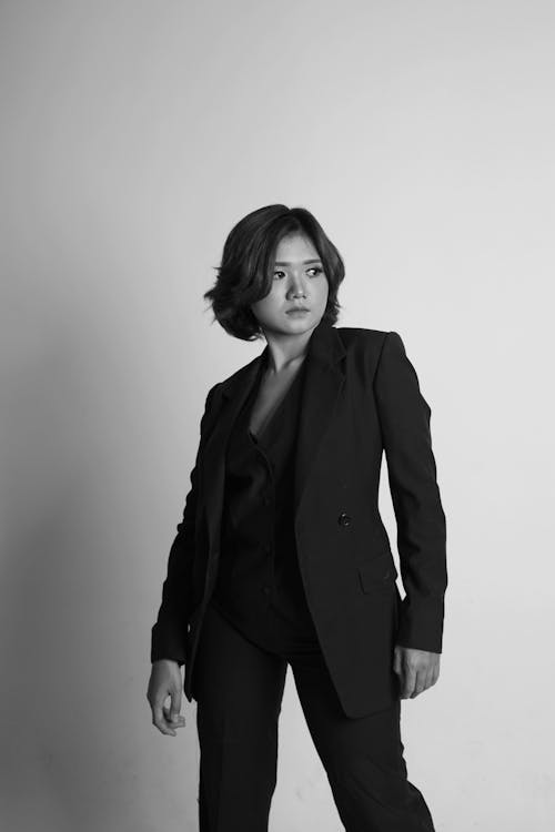 Grayscale Photo of Woman in Suit Jacket