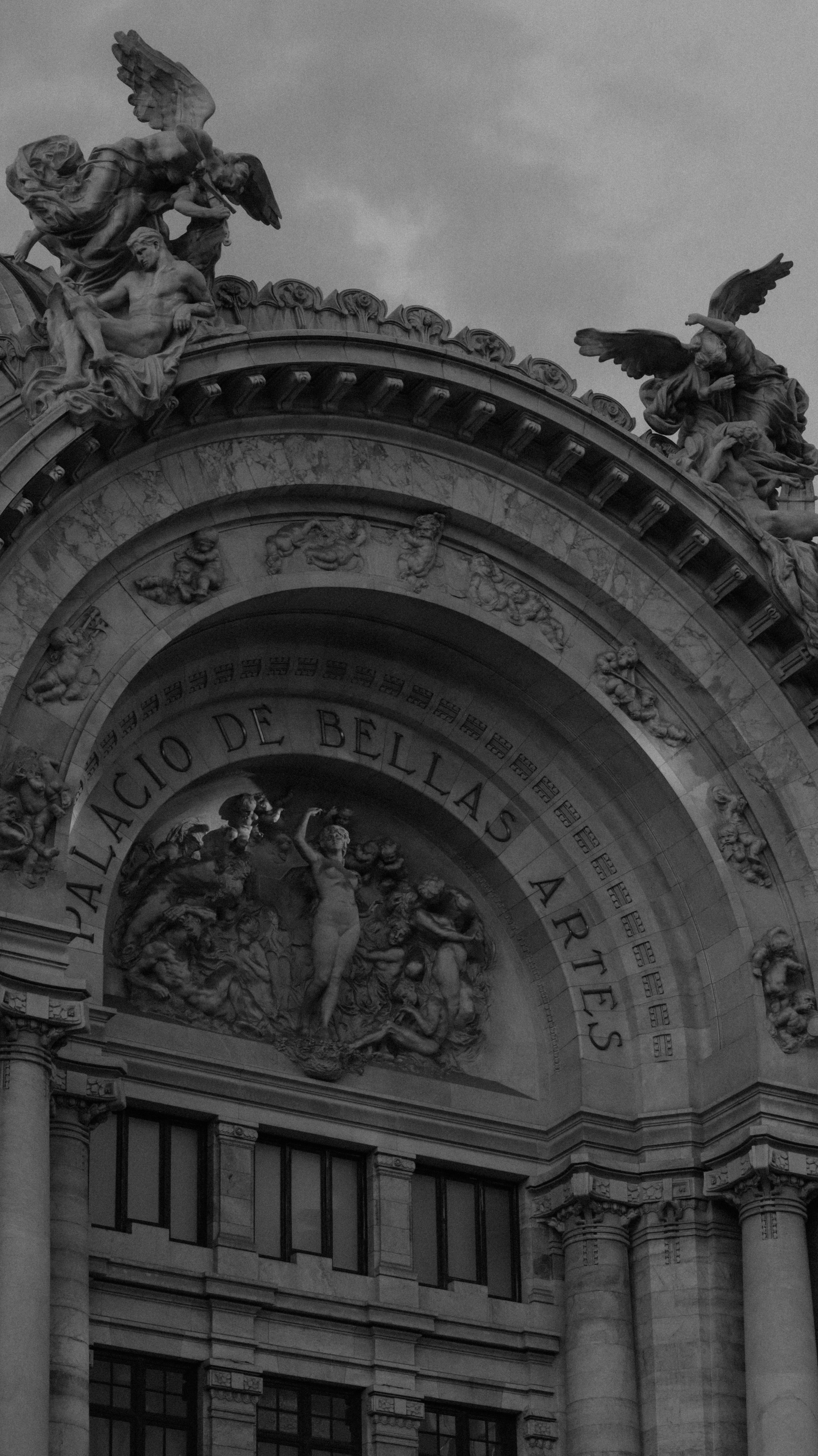 Black and white photo of Palacio de Bellas Artes in Mexico City highlighting Baroque architecture.