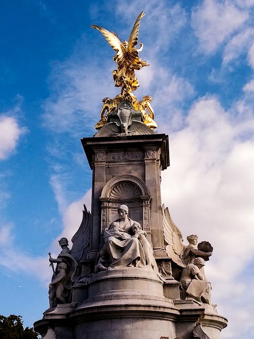 Free Gold Statue Under Blue Sky Stock Photo