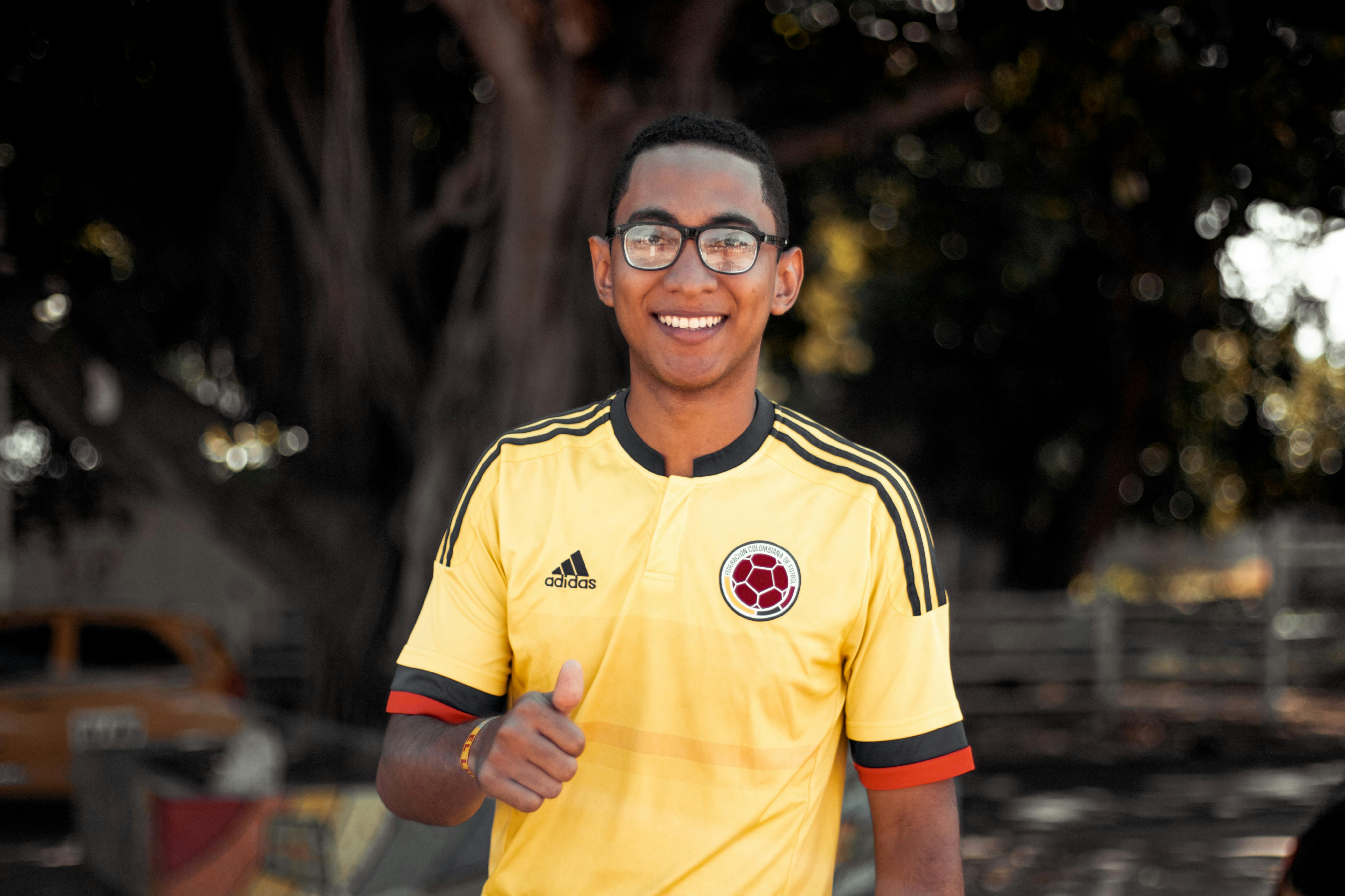 Man Wearing Yellow and Black Adidas Jersey Shirt \u00b7 Free Stock Photo