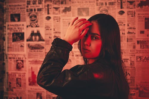 Free A woman in a leather jacket is looking at the camera Stock Photo