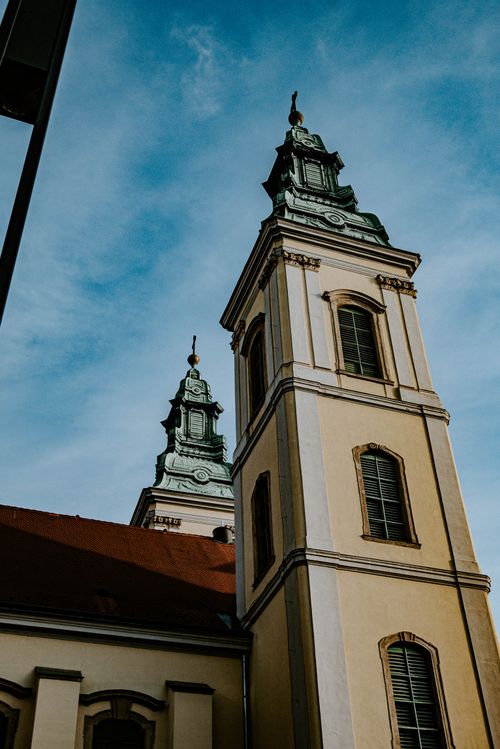 Free Vertical shot of Budapest's iconic church bell towers against a clear sky. Stock Photo