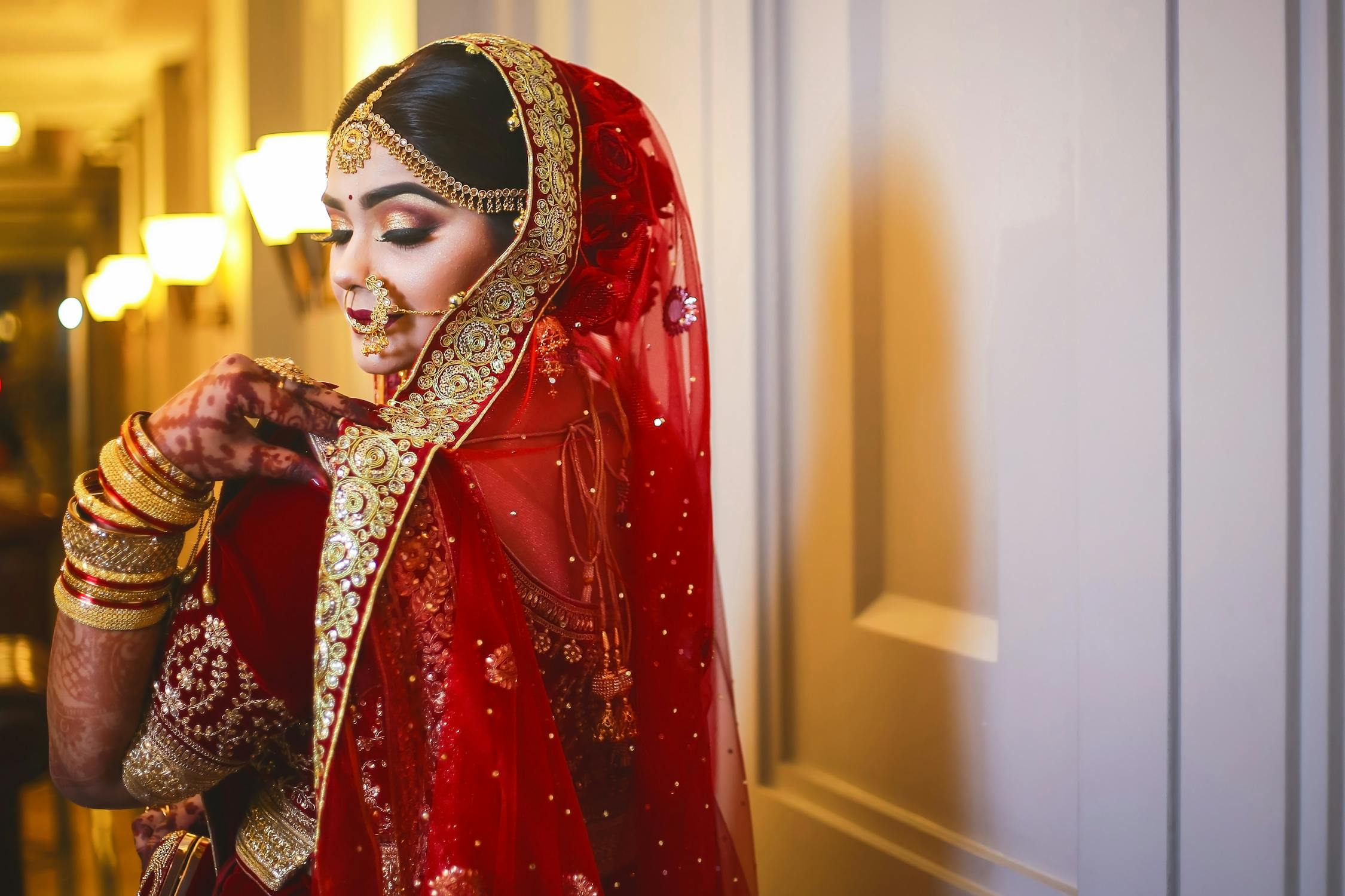 Indian Bride Photo by Farddin Protik from Pexels: https://www.pexels.com/photo/woman-in-floral-dress-standing-beside-door-2106463/
