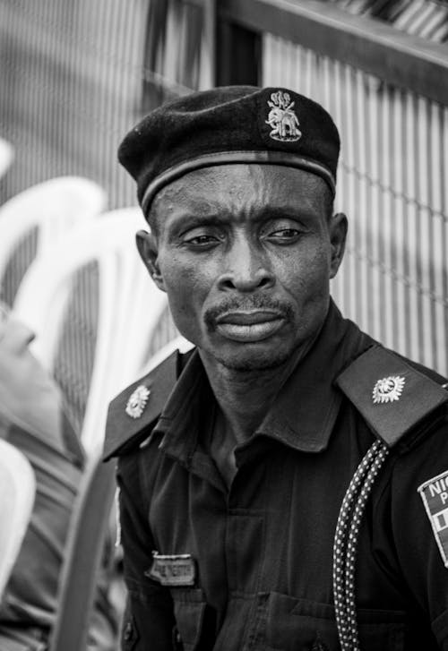 A black and white photo of a police officer