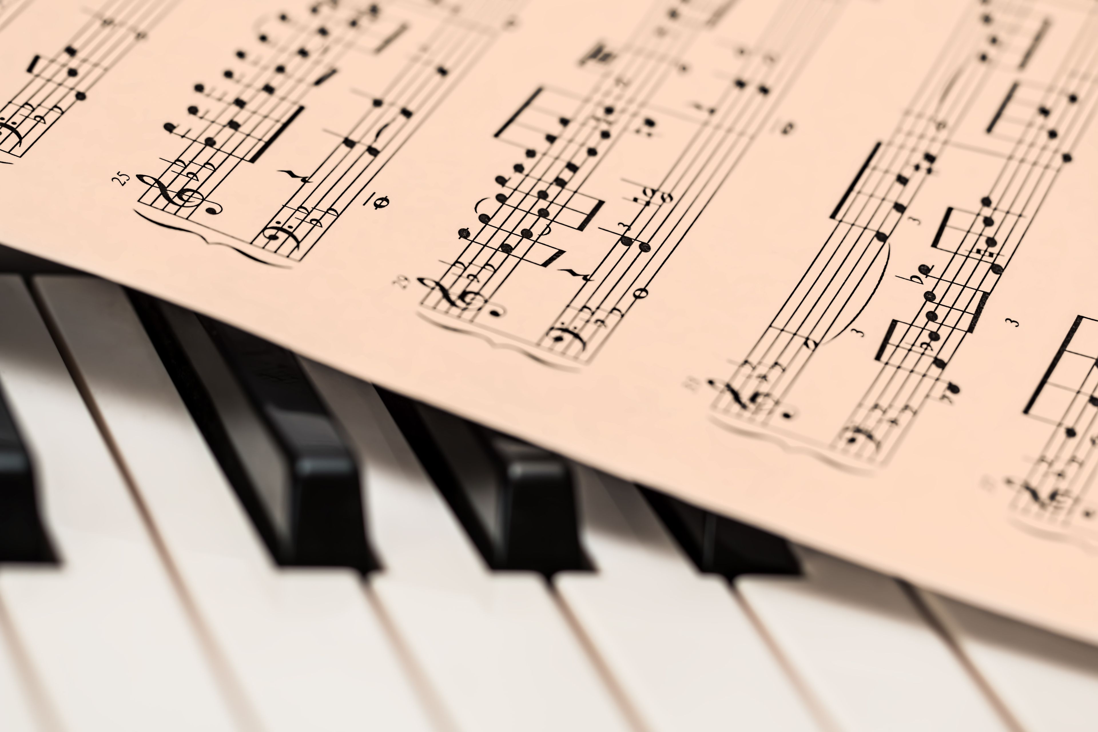 Piano keys in low warm light