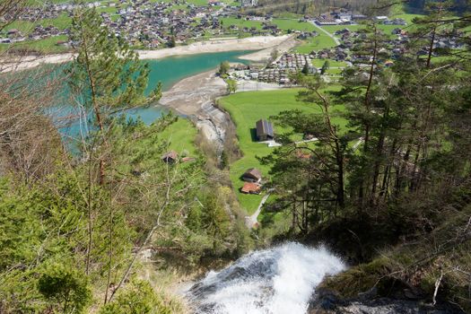 A captivating aerial shot of Lungern village and its picturesque lake in Switzerland.