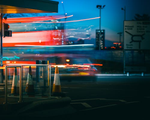 A blurry photo of a bus and a traffic light