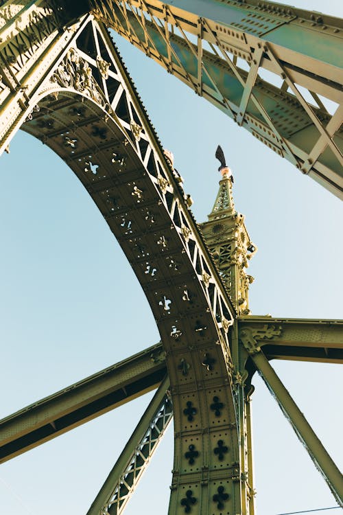 The top of a bridge with a clock on it