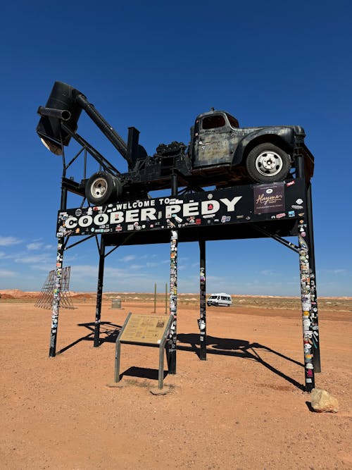 Truck on Welcome Billboard on Desert