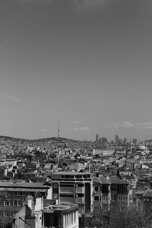 Black and white photo of a city with a view