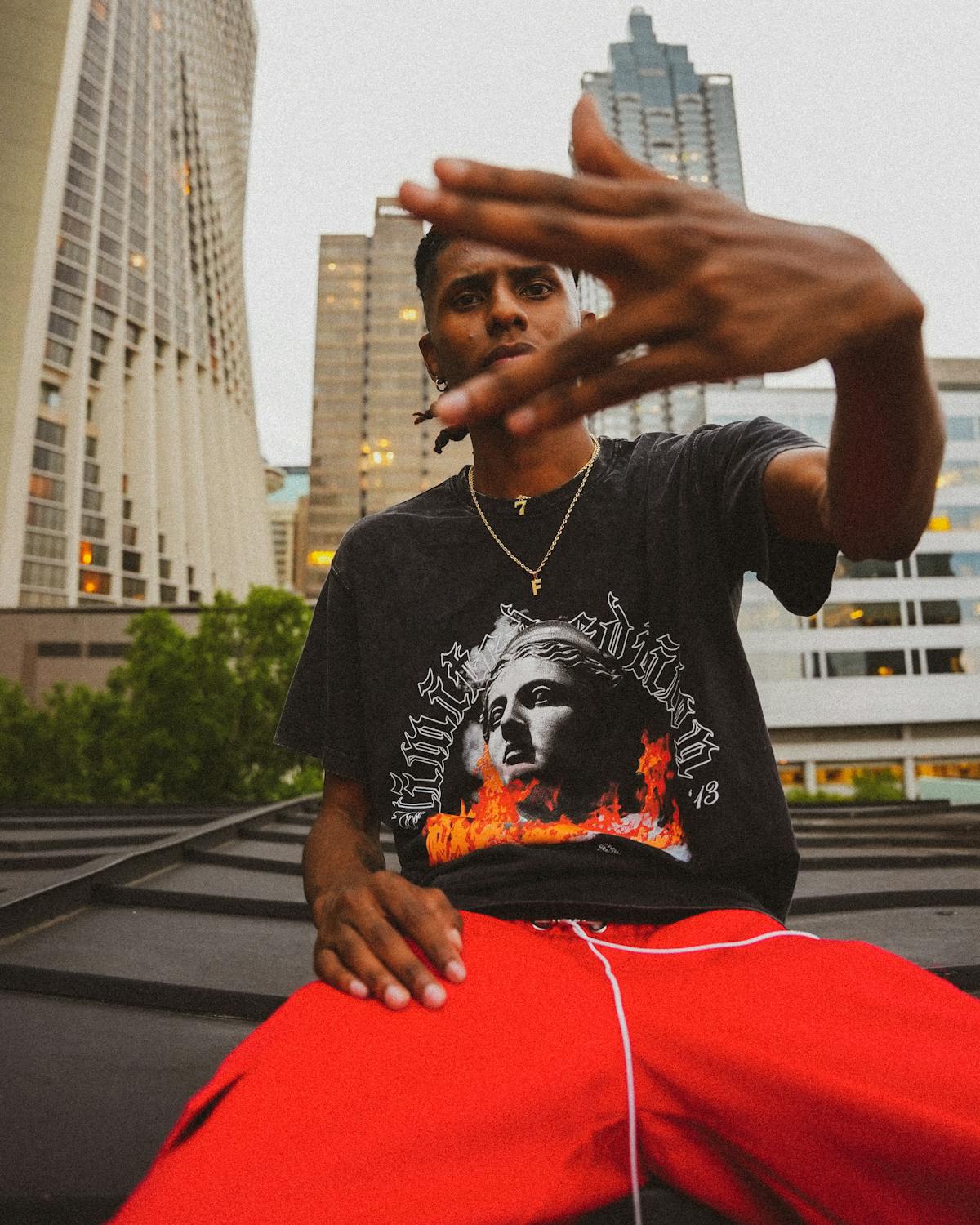 Rapper Wearing Red Trousers, Gesturing against Skyscrapers · Free Stock ...