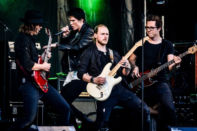 Group Of Four Men Rock Band