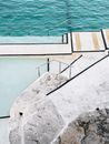 Grey Railings on Rock Near Body of Water