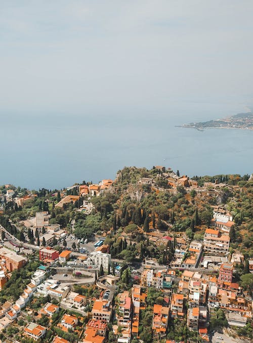 Free Aerial Photography of Buildings and Body of Water Stock Photo