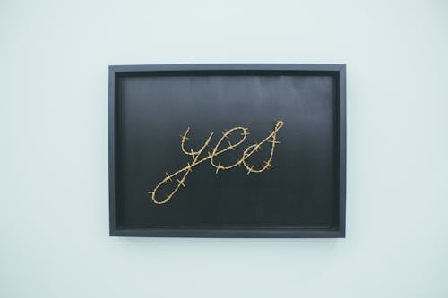 Free Yes Signage on Brown Wooden Chalkboard Stock Photo
