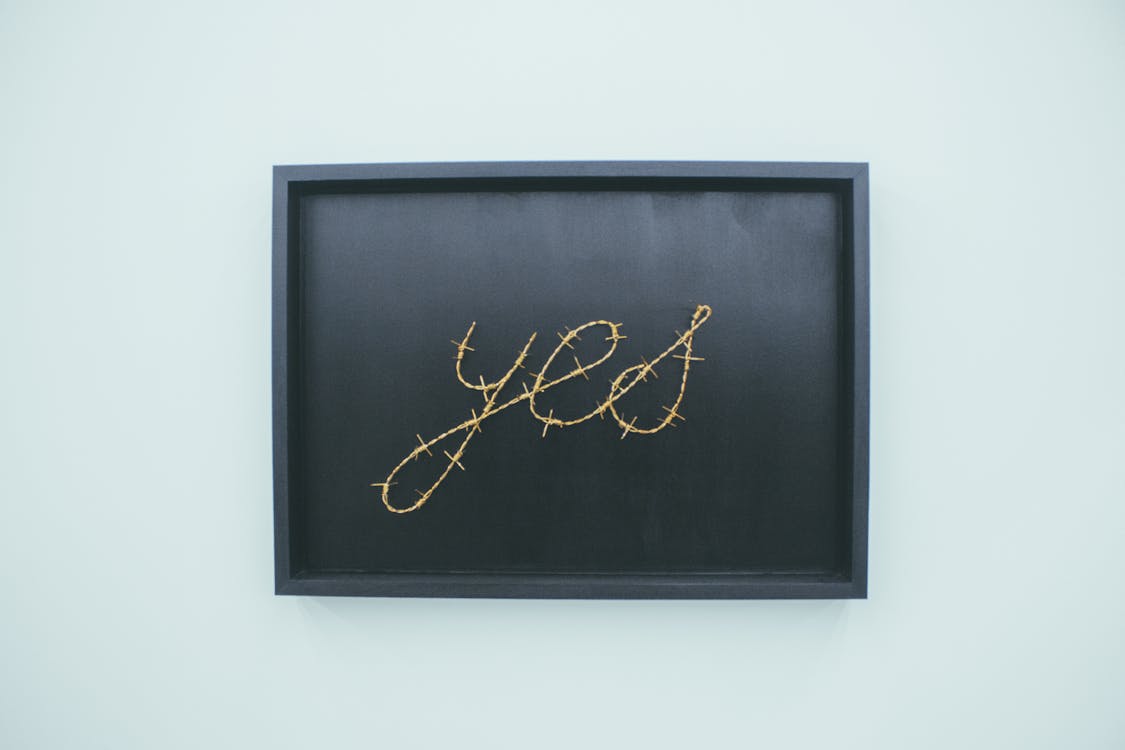 Yes Signage on Brown Wooden Chalkboard