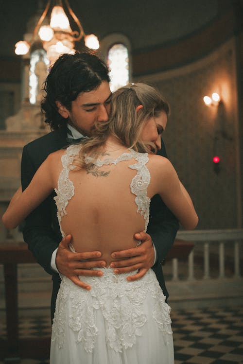 Free Man and Woman Hugging Inside Room Stock Photo