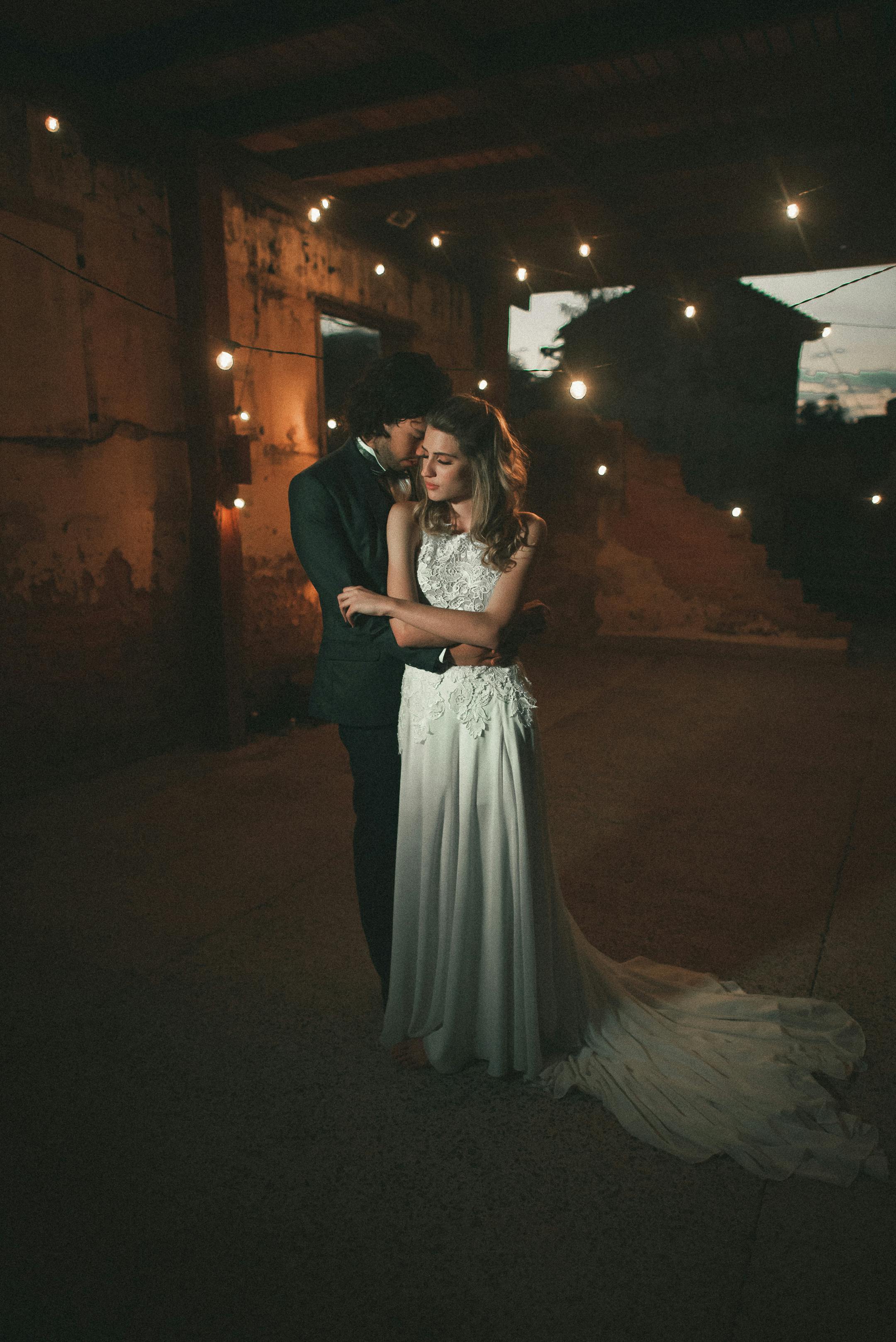 Woman Wearing Pink Wedding Gown Standing Next to Man 