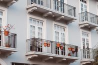 White Concrete Building With Black Metal Railings