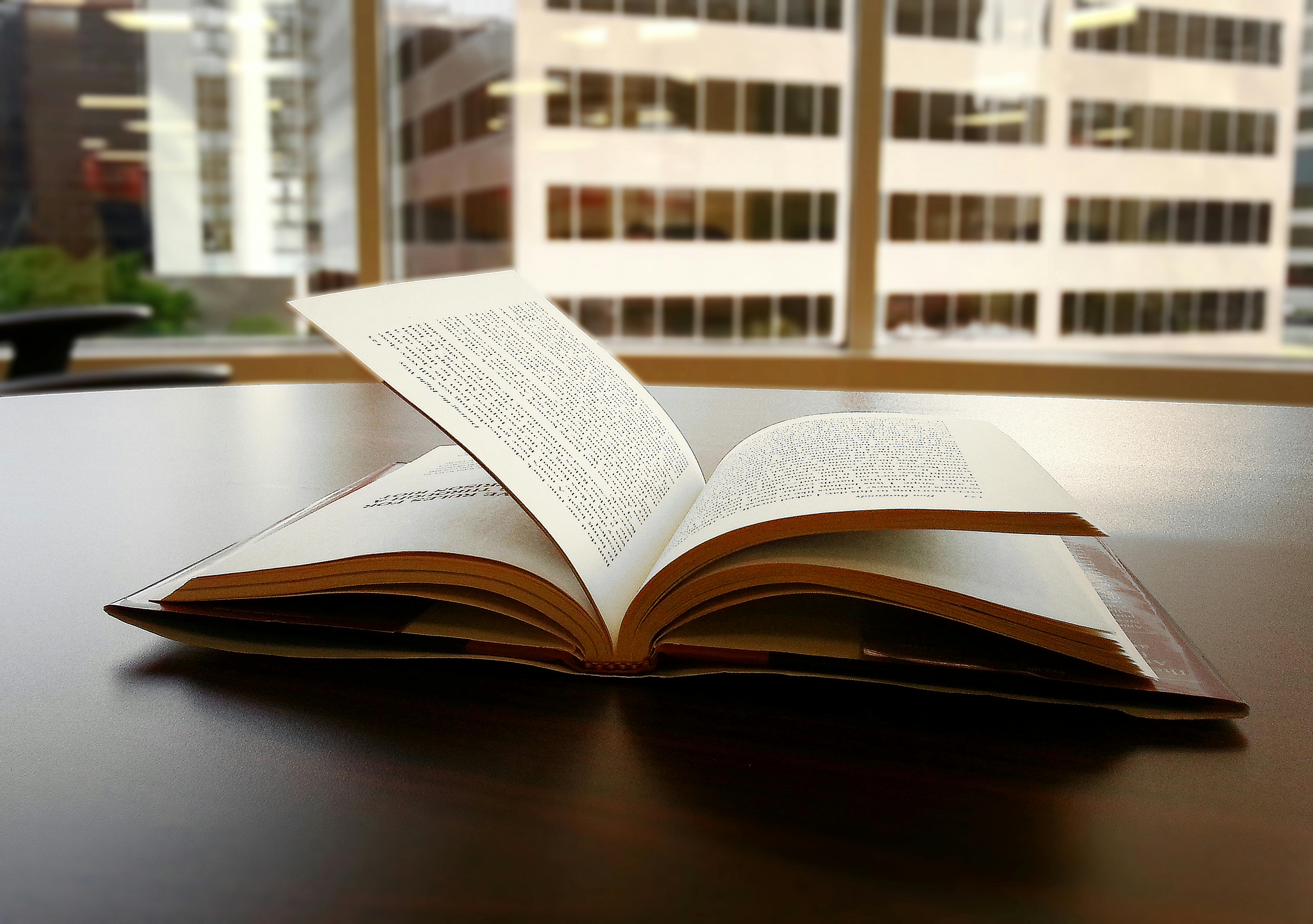 Opened Book on Top of Table · Free Stock Photo