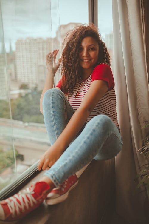 Woman Setting Beside Glass Window