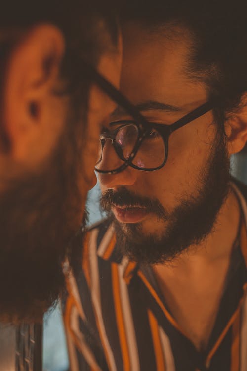 Free Man With Eyeglasses Looking to Mirror Stock Photo