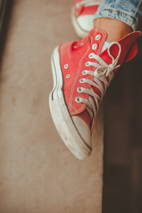 Person Wearing White-and-red High-top Sneaker