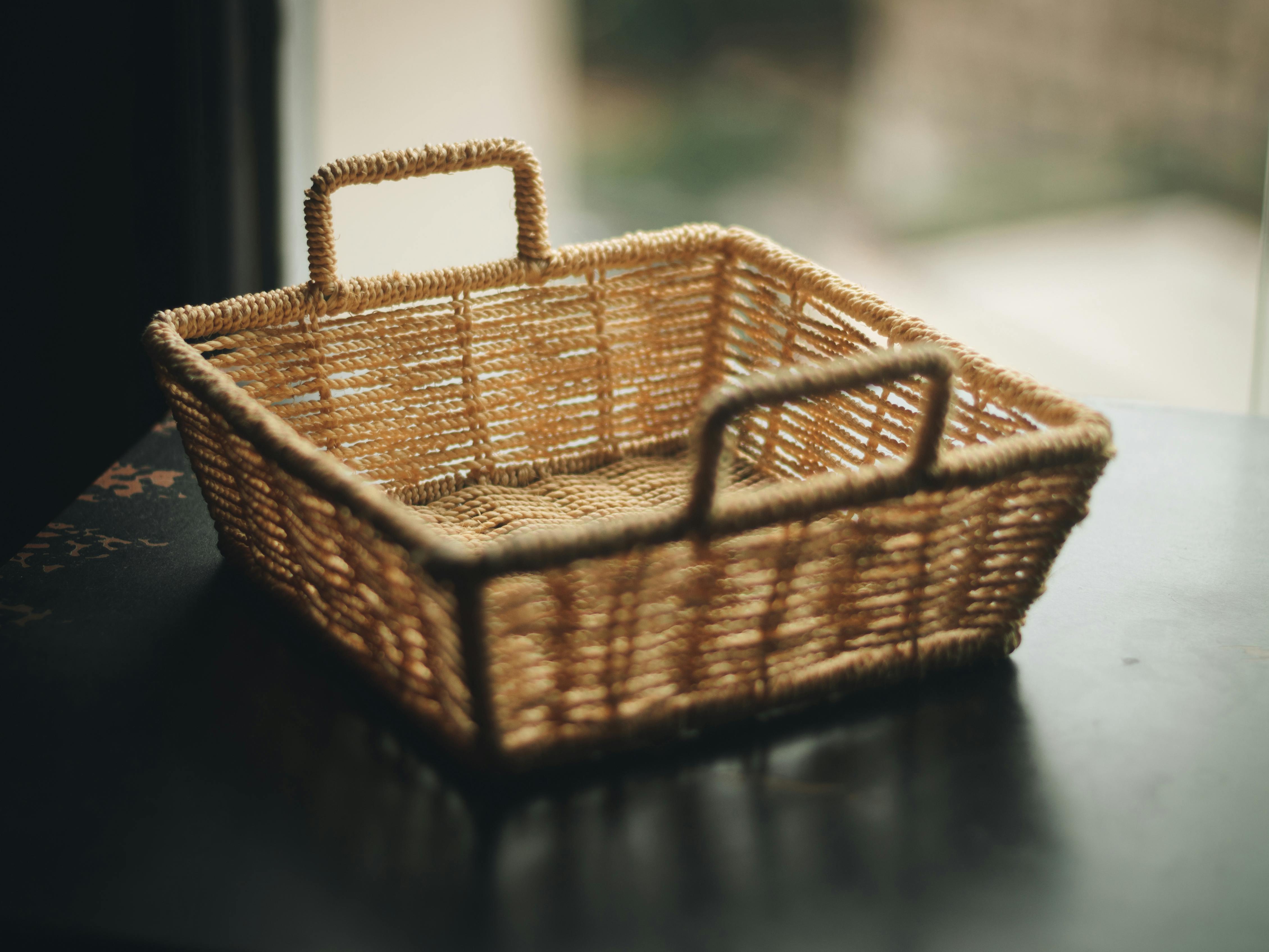 square brown wicker basket on table