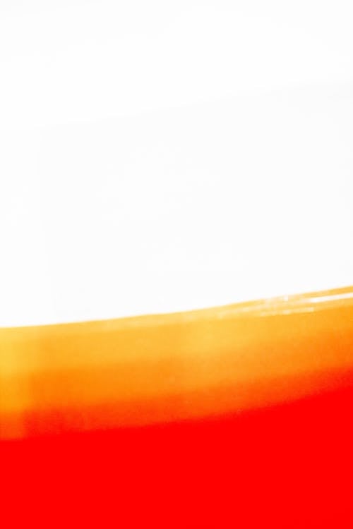 A red and orange glass with a white background