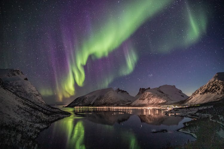 Mountain Beside Body Of Water With Aurora Borealis