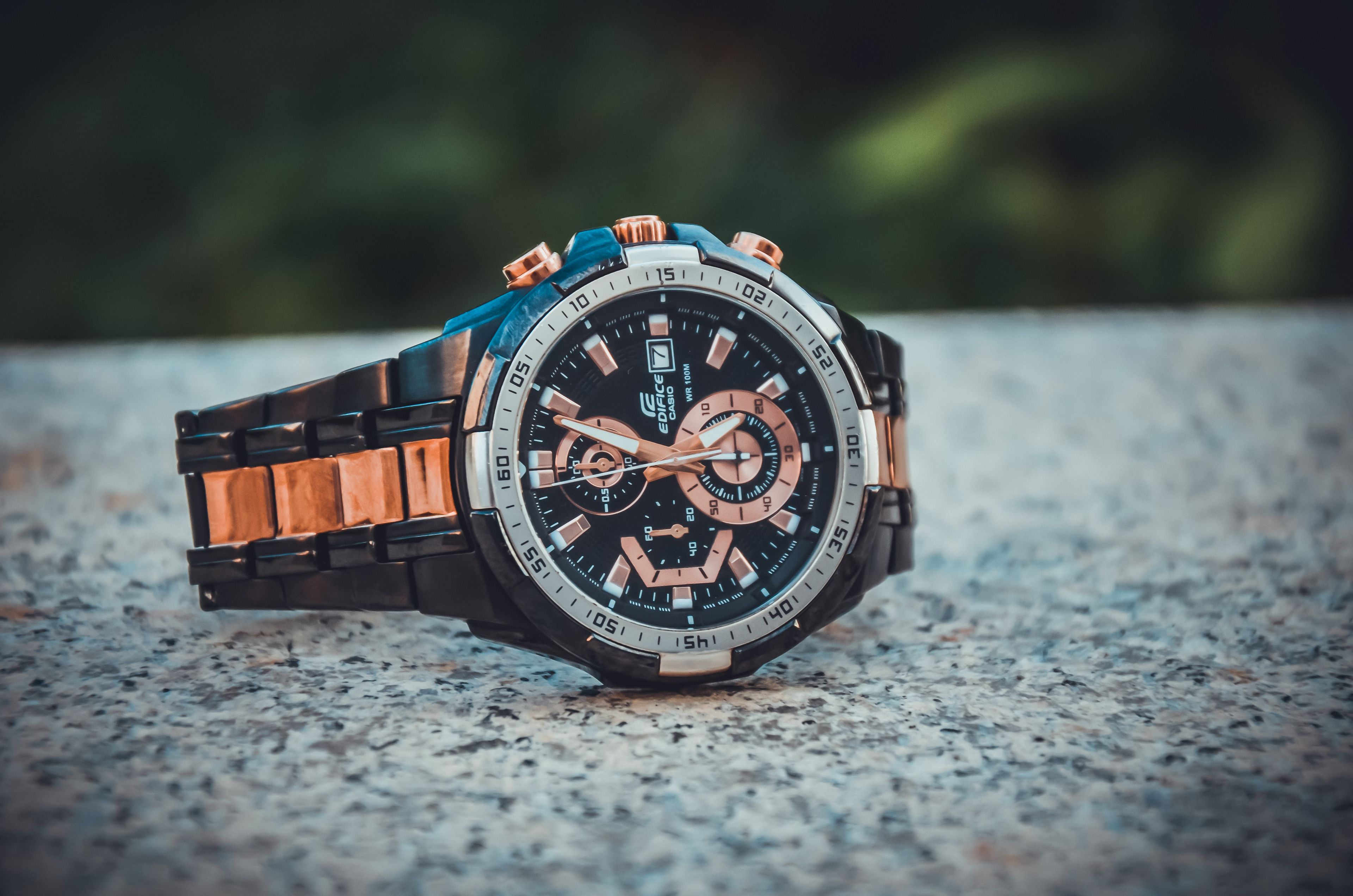 A rose-gold chronograph worn on the wrist