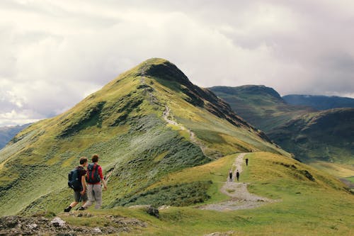 People Standing on Top of Mountain