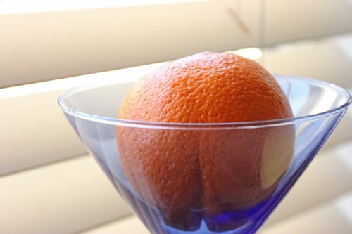 Fresh mandarin placed in cocktail glass