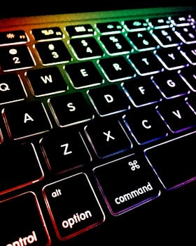 Close-up of a colorful backlit keyboard with glowing keys.