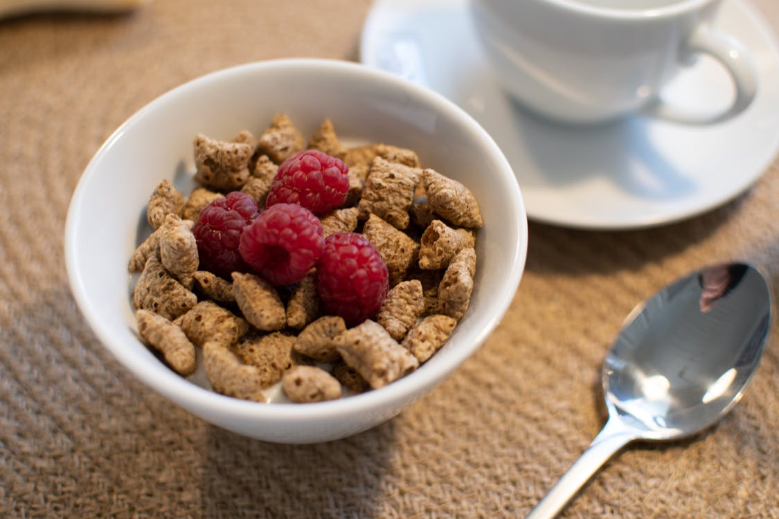 Free Bowl of Cereals with Raspberries  Stock Photo