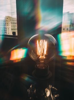 Warm glow of an Edison bulb against the São Paulo skyline, creating a vintage ambiance.