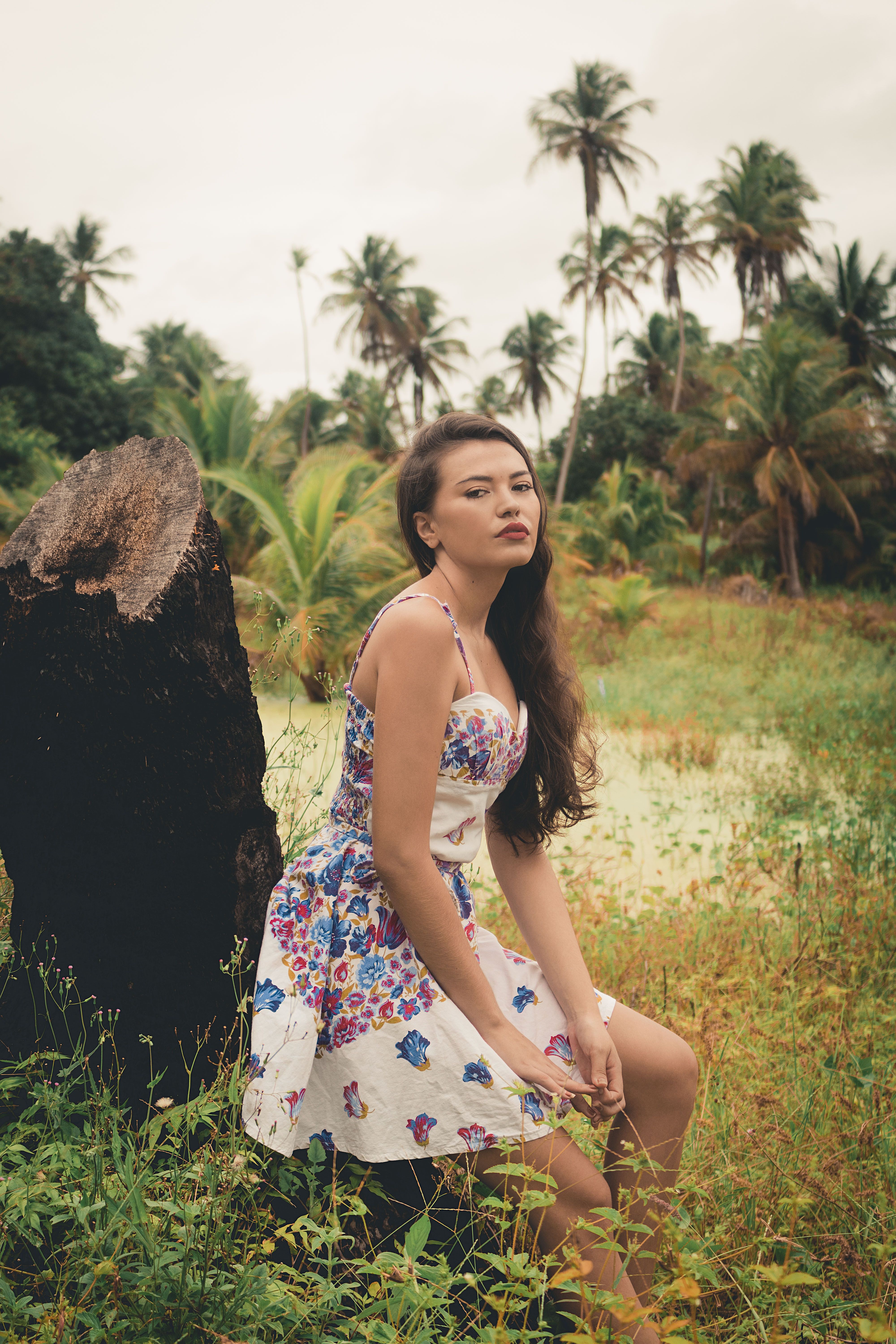 Woman In White Floral Dress Standing On Brown Grass Field · Free Stock ...